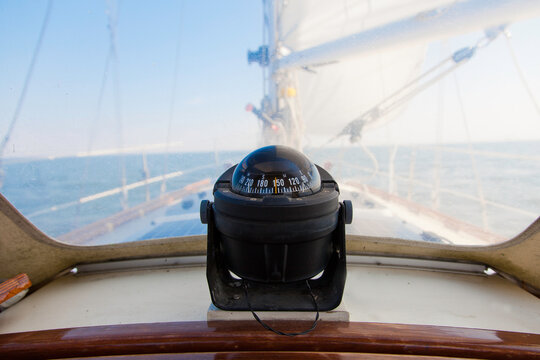 Close up of a compass on a sailboat