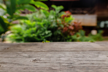 Empty top wooden table and blurred green nature background