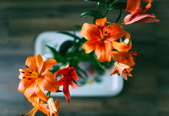 A bouquet of orange lilies from above