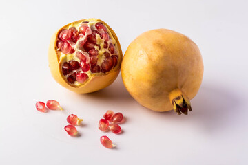 Yellow pomegranate on a white background