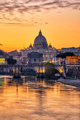 Naklejka na ściany i meble Sunset over the St. Peters Basilica and the river Tiber in Rome