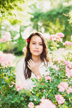 Portrait of a girl in rose garden