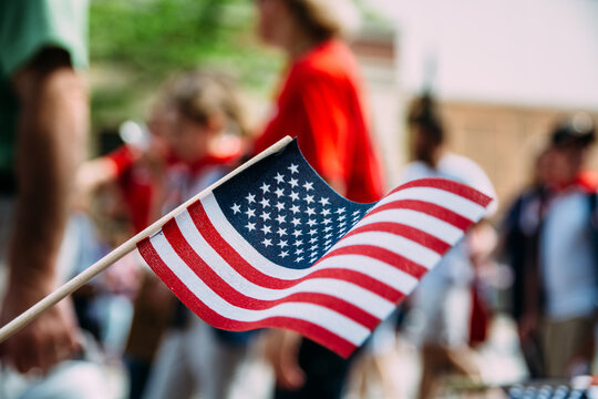 USA Flag Waved at A National Holiday Parade