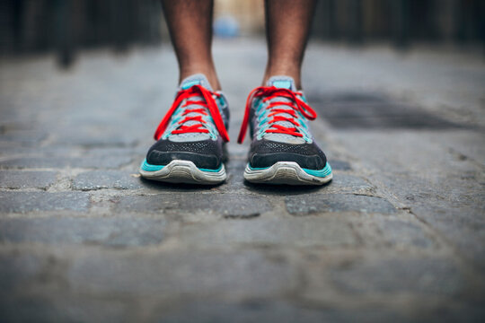 Close up of the shoes of a runner on the street.