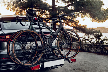 Crossover car with two road bicycles loaded on a rack