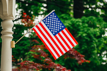 American flag displayed on a porch post