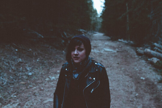 Young woman wearing mask in woods