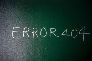 Error 404 written on green board with chalk, Page Not Found Error 404 written on a blackboard with chalk.