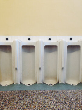 Men's urinal stalls in bathroom