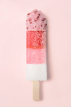 red, white and pink popsicle on pink background