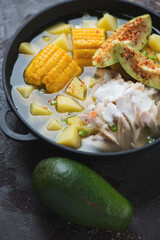 Closeup of colombian ajiaco or potato, chicken and corn stew, selective focus, studio shot