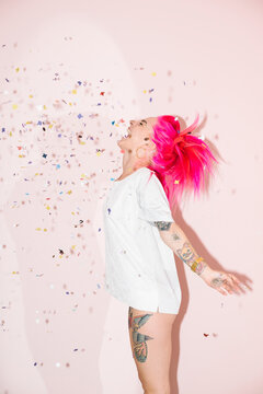 Young woman with confetti during a party