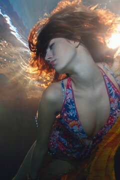 Fashion model wearing bikini underwater