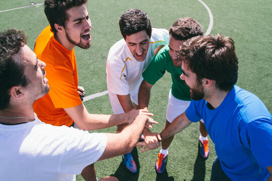 Soccer team player encouraging themselves during a football match