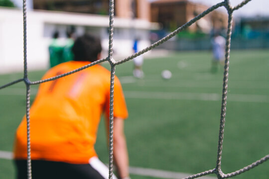 Keeper in a goal during a soccer match
