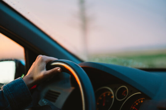 woman driving at sunset