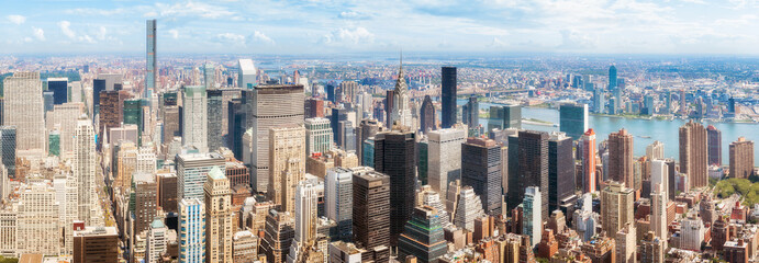 Panoramic view of New York City skyline on a sunny summer day, USA.