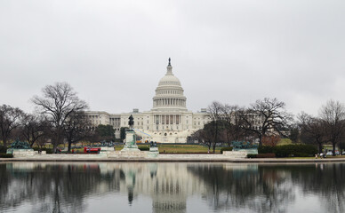 Amazing view of the US Capitol Building on a cloudy morning with the Reflection of the building in Capitol Reflection Pool