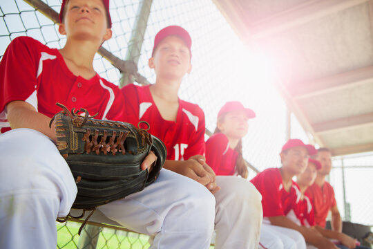 Baseball: Team Sits On Bench Waiting To Go To Field - Powered by Adobe