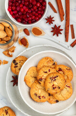 Freshly baked homemade Christmas cookies with cranberries, almonds, white chocolate, cinnamon and star anise. Delicious festive biscuit. Gingerbreads. Selective focus