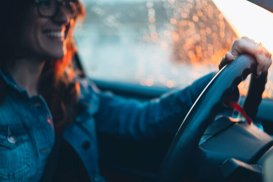woman driving at sunset