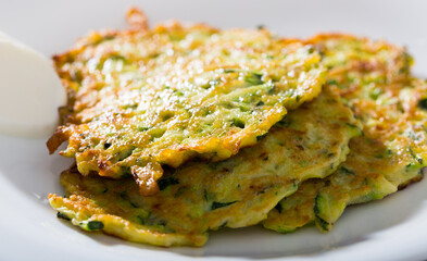 Pancakes from courgettes is tasty vegeterian dish in the kitchen.