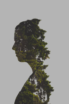 Dark, moody double exposure of teen girl using natural elements