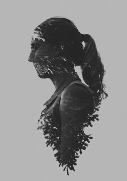 Dark, moody double exposure of teen girl using natural elements