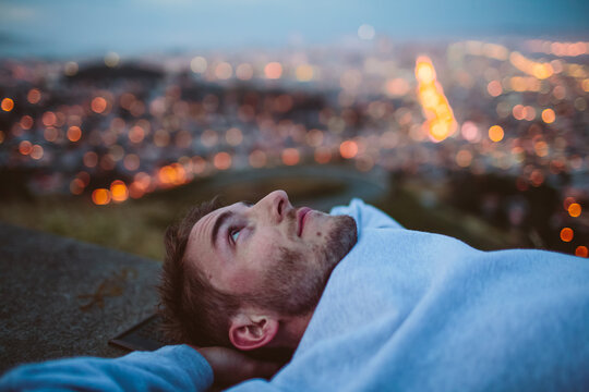 Young man takes an early gaze at the night sky