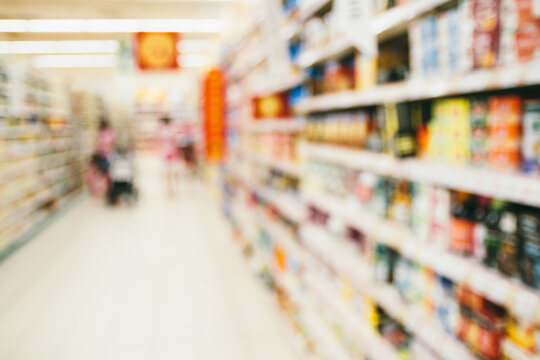 Supermarket shelves and corridor - blurred image