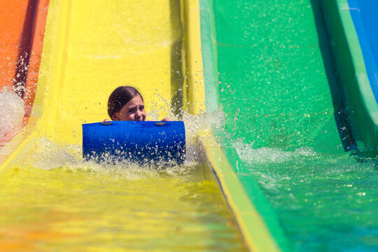 Little girl being afraid of water slide