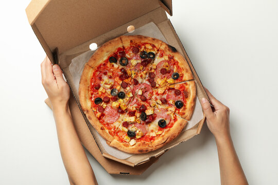 Tasty Pizza In Carton Box On White Background