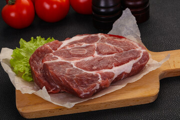 Raw pork neck steak