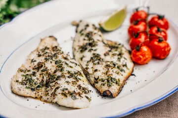 Food: Lemon balm marinated sea bream filet with roasted cherry tomatos