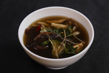Thai style soup with meat and mushrooms