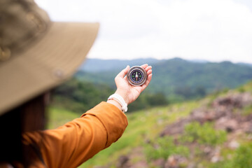 Hand traveler solo women holding compass at moutain,Navigation for travel © gballgiggs