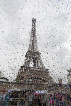 eiffel tower paris through a rainy window