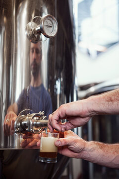 Beer: Man Taking A Sample Of Beer