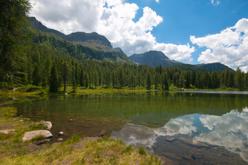Fototapeta na wymiar Panoramic view of San Pellegrino lake in San Pellegrino pass: a high mountain pass in the Italian Dolomites