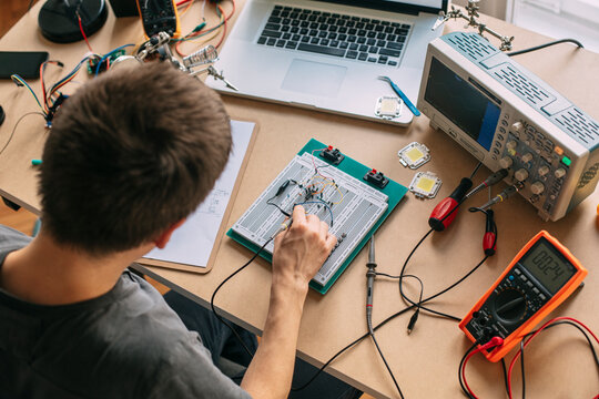 Engineer Testing Electronic Equipment at Home