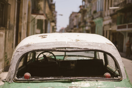 Vintage car with broken rear window