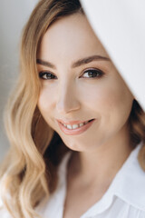 Naklejka premium Portrait of the bride with big beautiful eyes on white background