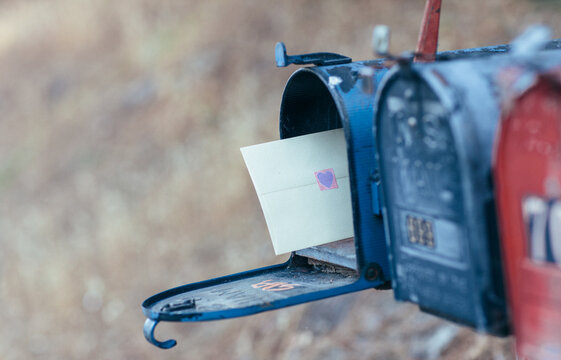 Mailbox with an envelope inside - heart sticker on the back