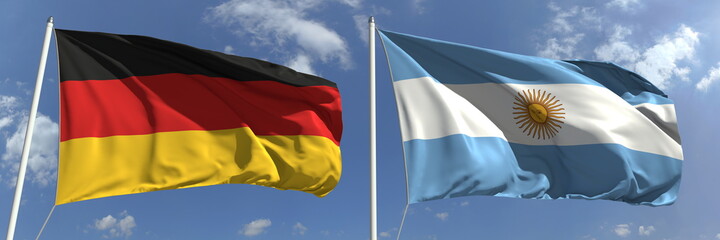 Obraz premium Flying flags of Germany and Argentina on high flagpoles. 3d rendering