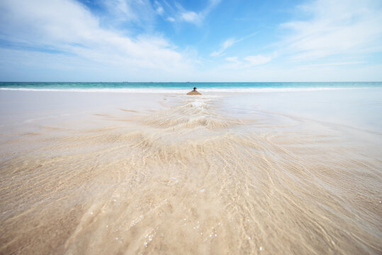 A tidal rip channel cuts though the sand