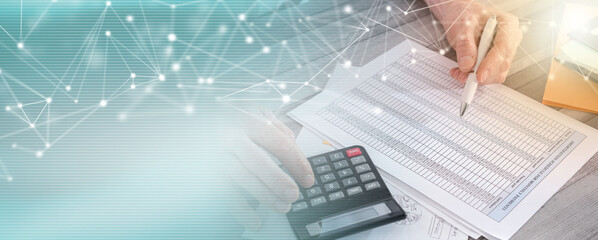 Hands of accountant businessman with calculator; panoramic banner