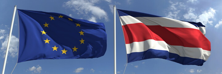 Fototapeta premium Flags of the European Union and Costa Rica on flagpoles. 3d rendering