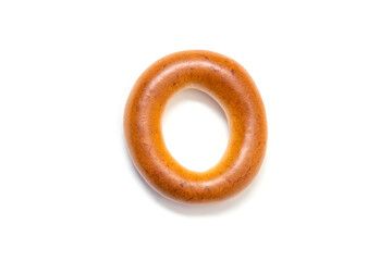 Golden, ruddy, uneven, round bagel on white isolated background
