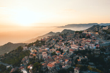 Fototapeta na wymiar Bova Superiore al tramonto, vista aerea del borgo calabrese sulle montagne.