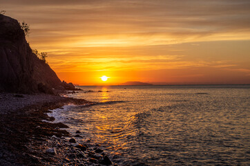 Meet the sunrise on the sea. Warm light